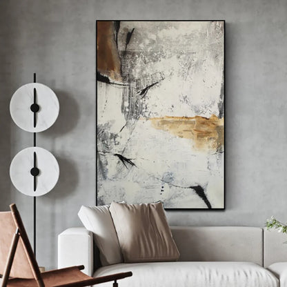 Abstract painting on a wall above a sofa in a living room setting