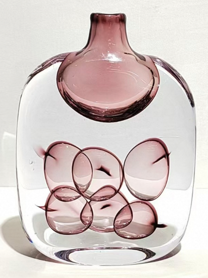 Glass vase with a unique design on a white background