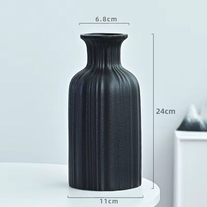 Black textured vase with dimensions on a light gray background