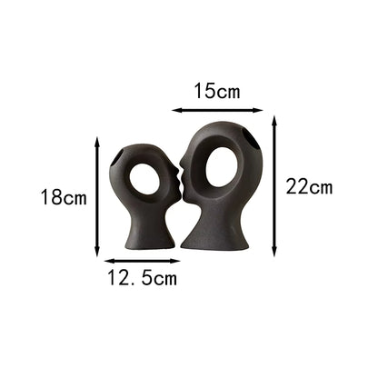 Two black rubber duckies with measurements on a white background