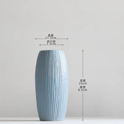 Blue textured vase with dimensions on a light gray background