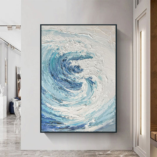 Abstract art piece with blue and white swirls in a modern interior setting