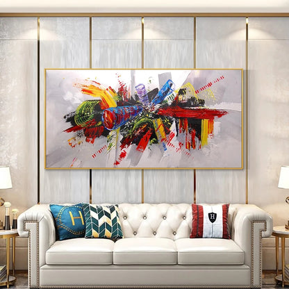 Colorful abstract painting above a white sofa in a living room setting.