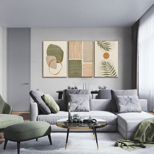 Modern living room with a gray sofa, green ottoman, and abstract art on the wall.