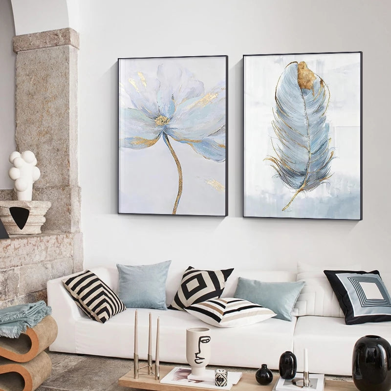 Living room with abstract wall art, white sofa, and decorative items.