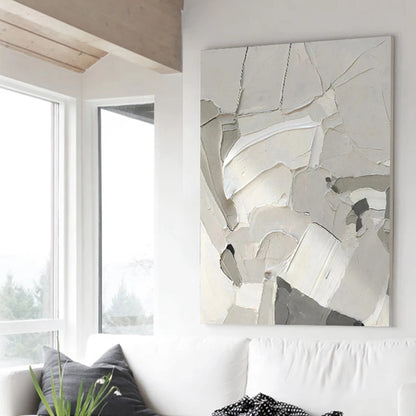 Abstract art piece on a wall in a modern living room
