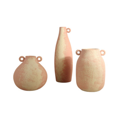 Three ceramic vases with textured surface on a white background