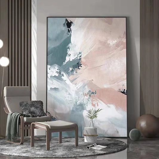 Abstract art piece in a modern living room setting with a chair and plant.