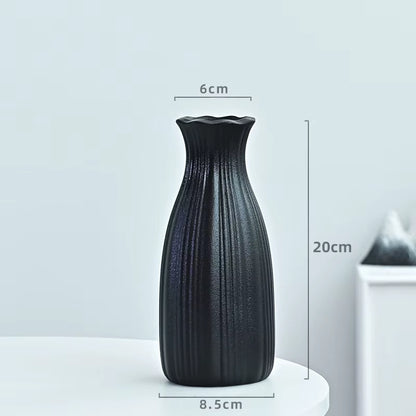Black textured vase with dimensions on a light gray background
