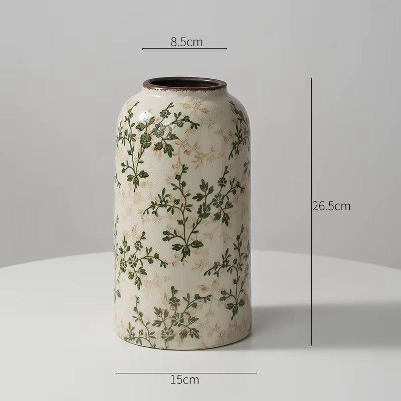 Decorative vase with floral patterns and measurements on a gray background