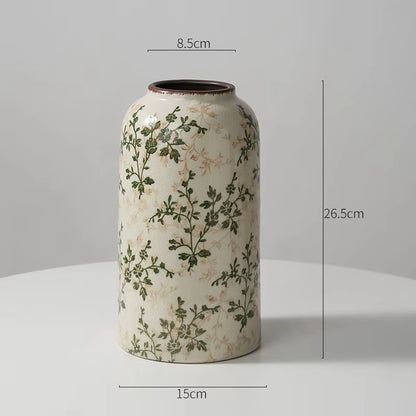 Decorative vase with floral patterns and measurements on a gray background