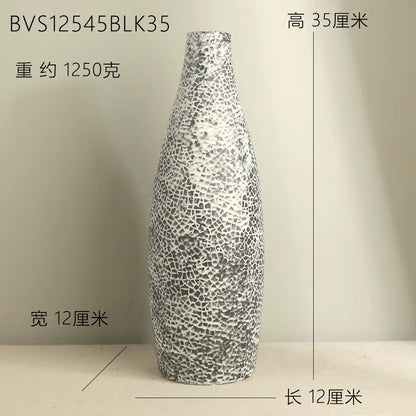 Silver textured vase on a beige background with measurements displayed.