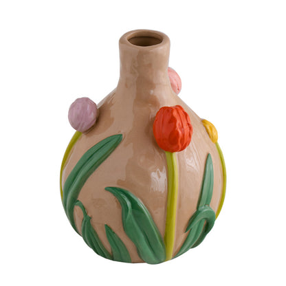 Ceramic vase with floral designs on a white background