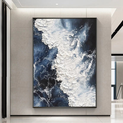 Abstract art piece with blue and white patterns in a modern interior setting
