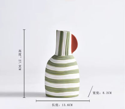 Striped ceramic vase with dimensions on a light gray background