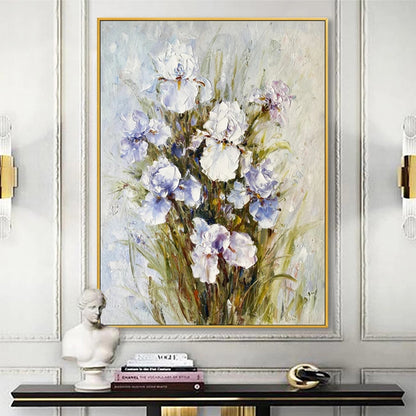 Framed floral painting on a wall above a console table with decorative items.
