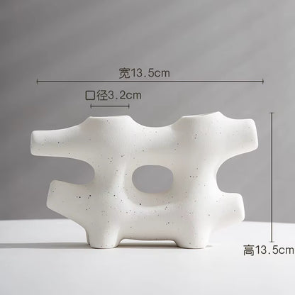 White abstract ceramic sculpture with dimensions on a gray background