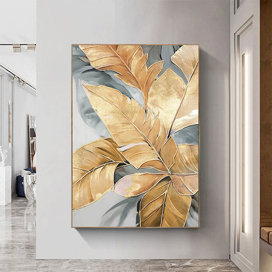 Decorative wall art with gold and gray leaves in a modern interior setting.
