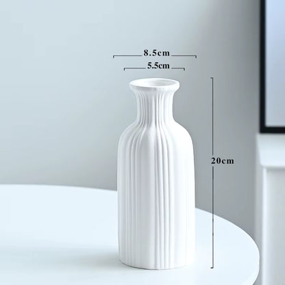 White textured vase with dimensions marked on a plain background
