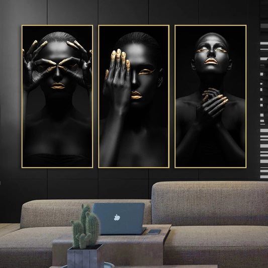 Three framed artworks of a woman with gold accents on a wall above a sofa.