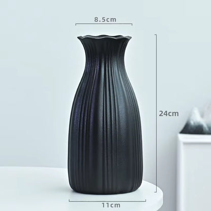 Black textured vase with dimensions on a light gray background
