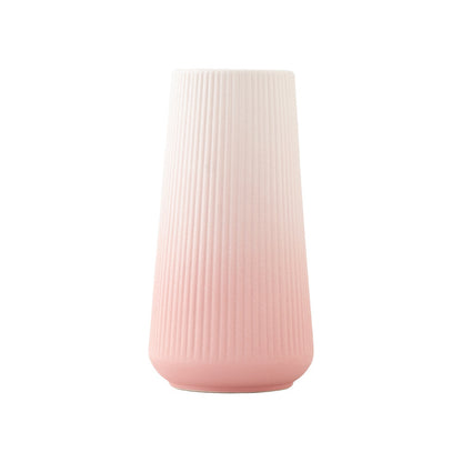 Pink textured vase on a white background
