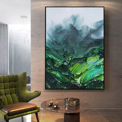 Abstract painting in a modern living room with a green chair and glass table.