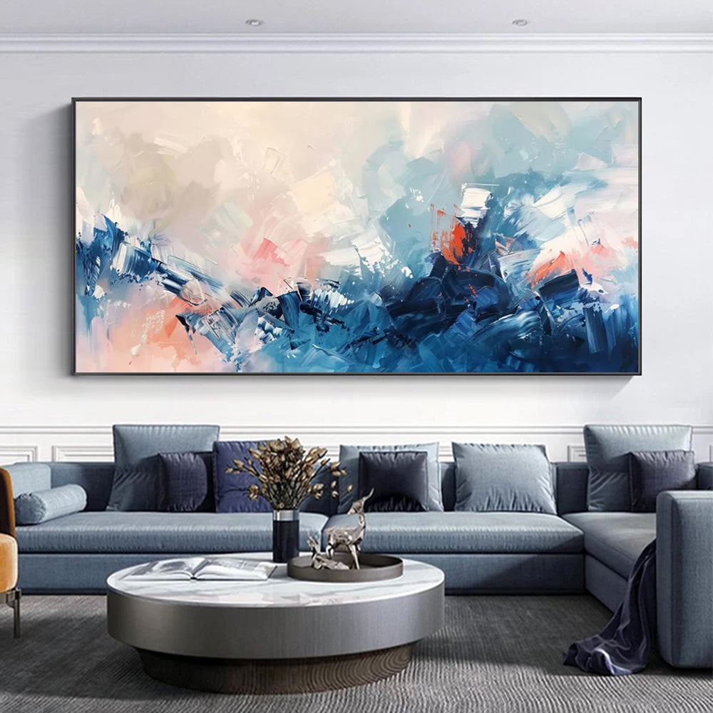 Living room with a large abstract painting on the wall above a gray sectional sofa.