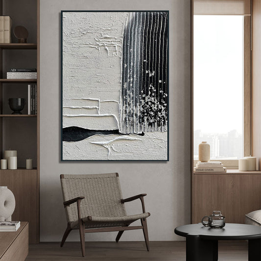 Abstract art piece on a wall in a modern interior setting with a chair and decor.