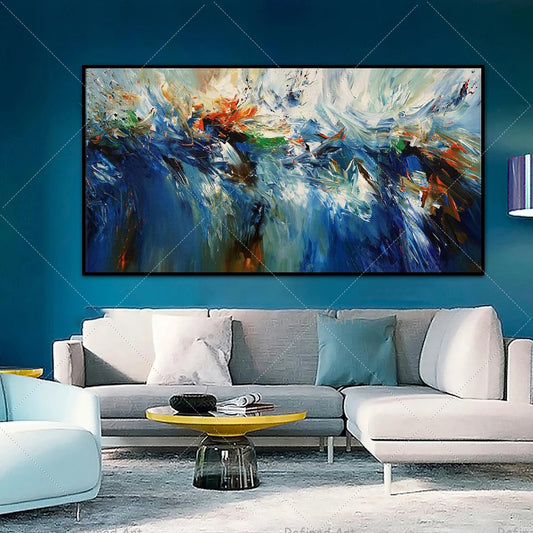 Abstract painting on a blue wall above a gray sofa in a living room.