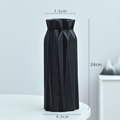 Black textured vase with dimensions on a light gray background