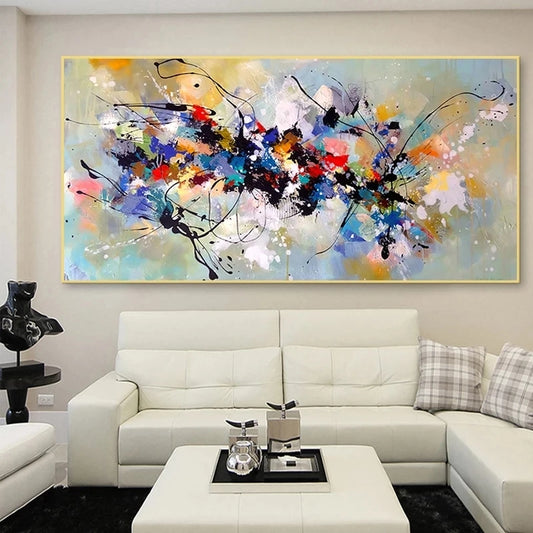 Abstract painting on a wall above a white sofa in a living room