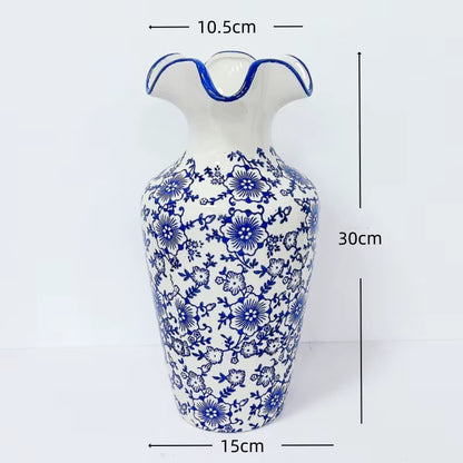 White vase with blue floral patterns and measurements on a white background