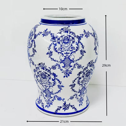 Blue and white ceramic vase with intricate patterns and measurements on a white background