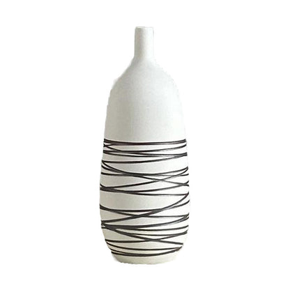 White vase with black wavy patterns on a white background
