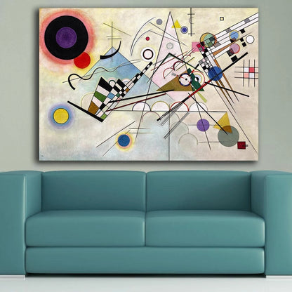Abstract artwork on a wall above a teal sofa