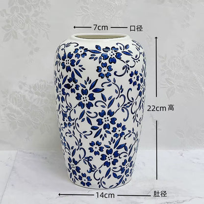 Ceramic vase with blue floral patterns on a white background