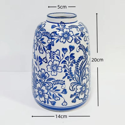 Ceramic vase with blue floral patterns and measurements on a white background