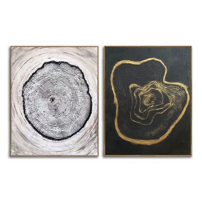 Two abstract art pieces, one black and white and the other gold on black, on a white background.