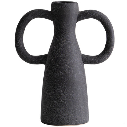 Black ceramic vase with two handles on a white background