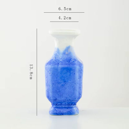 Blue ceramic vase with measurements on a white background