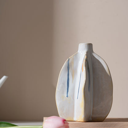 Ceramic vase with abstract design on a neutral background