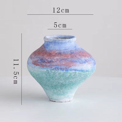 Ceramic vase with gradient color design and measurements on a light gray background