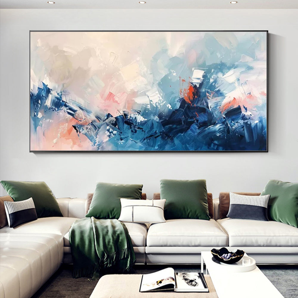 Abstract painting in a modern living room with a sectional sofa and decorative pillows.