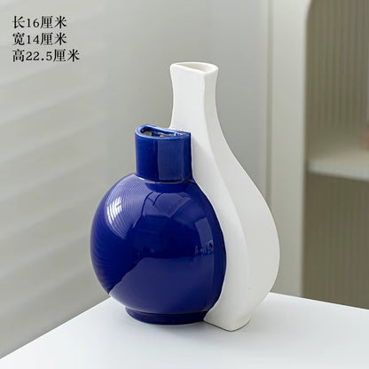 Blue and white ceramic vases on a light gray background