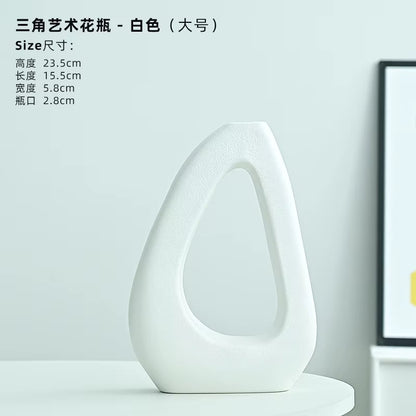 White artistic vase on a light gray background with product dimensions displayed.