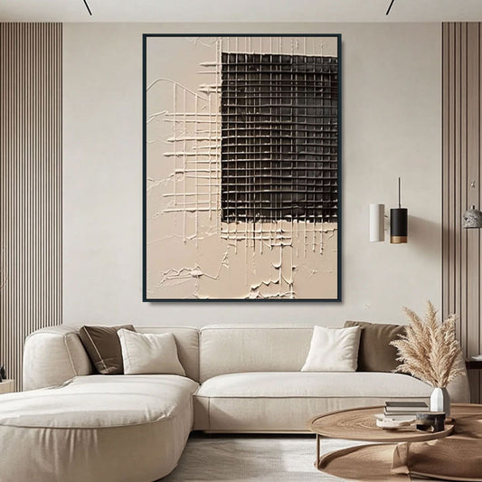 Modern living room with a beige sofa, abstract wall art, and decorative elements.
