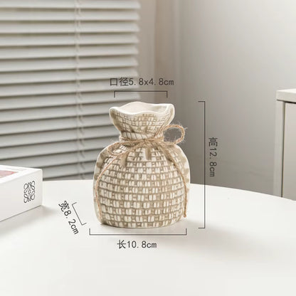 Woven decorative item with dimensions on a neutral background