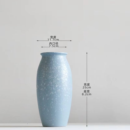 Blue ceramic vase with dimensions on a white background