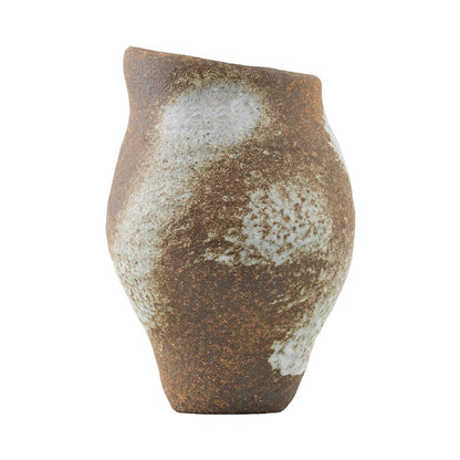 Rustic ceramic vase with a textured surface on a white background
